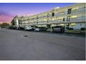 Assigned and covered parking underneath units, providing shade and protection from the elements at 1375 Doolittle Ln # 103, Dunedin, FL 34698