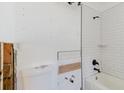 Bathroom with a new subway-tiled shower and black fixtures at 14031 E Parsley Dr, Madeira Beach, FL 33708