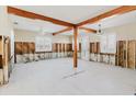 Bright living room featuring exposed wood beams and studs, offering a glimpse of the home's remodeling journey at 14031 E Parsley Dr, Madeira Beach, FL 33708