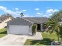 Charming single-story home with a two-car garage, landscaped yard, and inviting curb appeal at 1224 Cressford Pl, Brandon, FL 33511