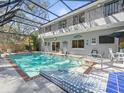 The pool features a tiled deck and a covered lanai, providing a perfect spot for outdoor entertainment at 3114 Samara Dr, Tampa, FL 33618