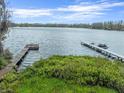 Picturesque waterfront featuring private docks and lush greenery along the lake, offering a serene and relaxing setting at 6302 Fitzgerald Rd, Odessa, FL 33556