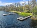 Waterfront view of the lake with private docks, perfect for boating and enjoying the scenic lake views at 6302 Fitzgerald Rd, Odessa, FL 33556