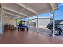 Spacious carport features a golf cart and parking for a Jeep at 845 Jolanda Cir, Venice, FL 34285