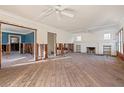 Renovation opportunity! Spacious living room with fireplace and large windows, ready for your personal touch at 864 15Th Ne Ave, St Petersburg, FL 33704