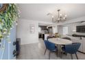 Open-concept living and dining area featuring a modern chandelier and lots of light at 1415 54Th N Ave, St Petersburg, FL 33703