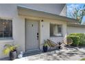 Cozy front entrance with potted plants and seating offering a tranquil welcome at 1828 Bough Ave # 3, Clearwater, FL 33760