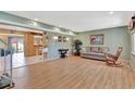 Spacious living room featuring light wood flooring and plenty of natural light at 4711 Travertine Dr, Tampa, FL 33615