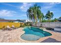 Beautifully designed pool area with brick patio, perfect for outdoor relaxation and entertainment at 4711 Travertine Dr, Tampa, FL 33615