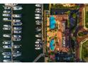 Aerial view of a marina featuring numerous boats alongside the resort style pool and clubhouse at 6030 Printery St # 107, Tampa, FL 33616