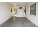 Spacious carport area with ample storage and access to the home's side entrance at 7816 38Th N Ter # 7816, St Petersburg, FL 33709