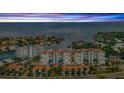 Scenic aerial shot featuring a condominium complex near the water at sunset, showcasing coastal living at 1325 Snell Isle Ne Blvd # 611, St Petersburg, FL 33704