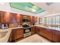 This spacious kitchen features granite countertops, stainless appliances and custom wood cabinetry at 17940 Gulf Blvd # 2B, Redington Shores, FL 33708