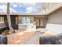 Charming home featuring stone accents, decorative shutters and a brick entryway at 2080 Attache Ct, Clearwater, FL 33764