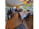 Inviting living room and dining area with a ceiling fan and sliding glass doors to the patio at 24862 Us Highway 19 N # 2906, Clearwater, FL 33763
