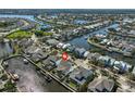 Aerial shot highlighting waterfront property, canals, and neighborhood layout at 413 Islebay Dr, Apollo Beach, FL 33572
