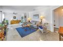 Bright living room with a geometric rug, ceiling fan, and ample natural light at 4322 22Nd N Ave, St Petersburg, FL 33713