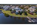 Expansive backyard leading to a private dock and waterfront access at 5321 Fishersound Ln, Apollo Beach, FL 33572