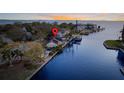 Waterfront residence with dock access and serene water views from the backyard at 56 Sandpiper Rd, Tampa, FL 33609
