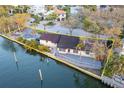 Waterfront property featuring outlined boundaries and a private boat dock at 56 Sandpiper Rd, Tampa, FL 33609