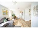 Open living area with modern decor, dining space, and seamless flow throughout the home at 6906 N Central Ave, Tampa, FL 33604