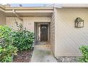 Inviting front entrance with a decorative door and stone accents at 102 Old Mill Pond Rd, Palm Harbor, FL 34683