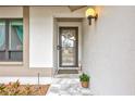 Welcoming front entryway with marble steps and neutral decor; perfect blend of style and function at 11430 94Th St, Largo, FL 33773