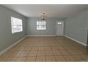 Bright living room with tile flooring and large windows offering ample natural light at 4501 67Th N St, St Petersburg, FL 33709