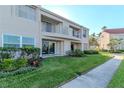 Well-maintained condo building with manicured lawn, private patios, and beautiful landscaping at 6100 Bahia Del Mar Cir # 102, St Petersburg, FL 33715