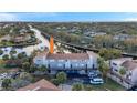 Stunning aerial view of waterfront condo community with lush landscaping and boat docks at 6311 Newtown Cir # 11B2, Tampa, FL 33615