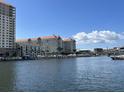 Scenic view of the condo building with a waterfront, bridge and boat docks under a blue sky at 700 S Harbour Island Blvd # 204, Tampa, FL 33602