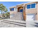 Beautiful home with a grand staircase, double-door entry, and attached garages at 733 Seminole Blvd, Tarpon Springs, FL 34689