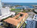 Aerial view of the complex featuring a pool, landscaping and proximity to the harbor, parks, and downtown at 100 4Th S Ave # 208, St Petersburg, FL 33701