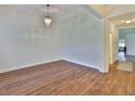 Spacious living room with hardwood floors and an elegant chandelier at 13908 Artesa Bell Dr, Riverview, FL 33579