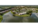 Aerial view of the neighborhood featuring residences near a serene lake at 142 Lakeview Way # 142, Oldsmar, FL 34677