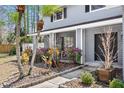 Close up of the front entrance featuring potted flowers, brickwork and the double door at 15802 Knollview Dr, Tampa, FL 33624