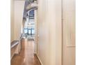 Hallway leading to a modern living area with floor-to-ceiling windows, and view of the outside at 175 2Nd S St # 1014, St Petersburg, FL 33701