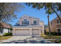 Charming two-story home with a three car garage and manicured landscaping at 17923 Timber View St, Tampa, FL 33647
