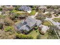 Spacious home with screened-in pool, lush landscaping, and private backyard oasis at 2280 Mackenzie Ct, Clearwater, FL 33765