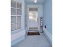 Welcoming entryway with a decorative welcome sign and a 'HOME' doormat at 4331 Foxboro Dr, New Port Richey, FL 34653