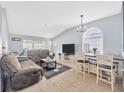 Bright and airy living room featuring tile floors, and comfortable seating at 4331 Foxboro Dr, New Port Richey, FL 34653