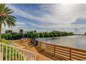 Dockside lounging area with deck chairs and grills overlooking the water at 5000 Culbreath Key Way # 1-310, Tampa, FL 33611