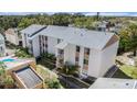 An aerial view shows the condo building's layout, surroundings, and community landscaping at 9960 5Th St. N. # 304, St Petersburg, FL 33702
