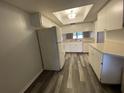 A bright kitchen features appliances, ample cabinet space, and a modern gray-tone floor at 2131 Ridge S Rd # 86, Largo, FL 33778