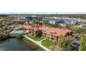 Gorgeous condominiums with a community pool surrounded by manicured landscaping and beautiful lake views at 2709 Via Cipriani # 532B, Clearwater, FL 33764