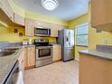 Well-equipped kitchen with stainless steel appliances and ample counter space at 3001 58Th S Ave # 912, St Petersburg, FL 33712