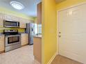 Bright kitchen featuring stainless steel appliances, tile flooring, and modern cabinetry at 3001 58Th S Ave # 912, St Petersburg, FL 33712
