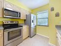Modern kitchen featuring stainless steel appliances, bright natural light, and ample storage at 3001 58Th S Ave # 912, St Petersburg, FL 33712