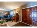 Living room featuring wood doors and a cozy seating area with a large sectional sofa at 736 Flamingo Dr, Apollo Beach, FL 33572