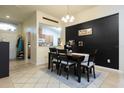 Inviting dining room with stylish decor, a modern light fixture, and a view into the adjacent kitchen at 895 Sea Holly Dr, Brooksville, FL 34604